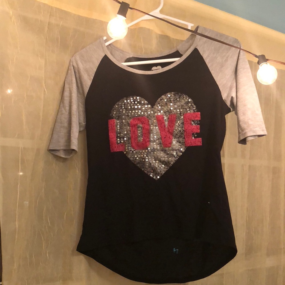 A cute girls love tee with sequins.